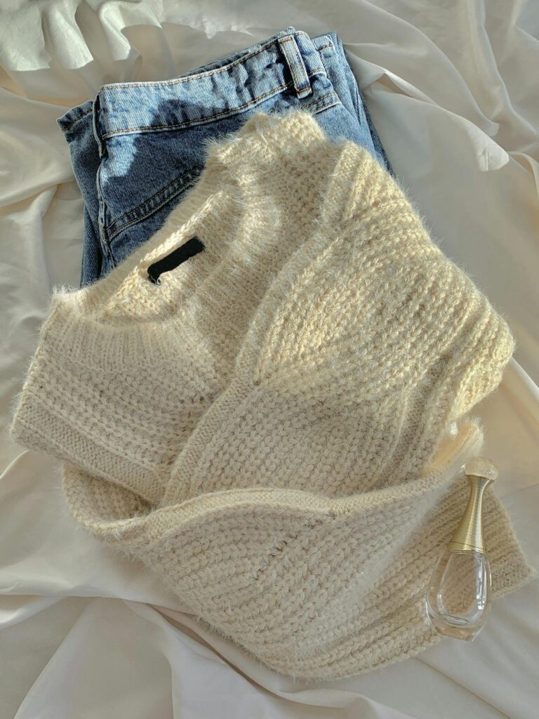 Warm wool sweater paired with classic blue jeans for a cozy winter look.