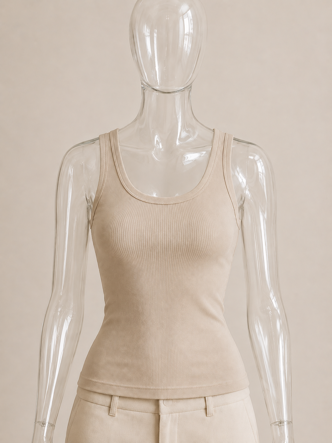 Stone rib tank top by CG Claudia Garcia displayed on a transparent glass mannequin against a soft beige background.